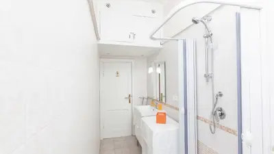 a small kitchen with a sink and a microwave at Rental in Rome Sistina View in Rome
