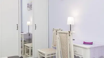 a bedroom with a large bed and a desk at Rental in Rome Sistina View in Rome