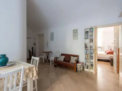 a living room with a couch and a table at Central Station Enchanting Apartments in Rome
