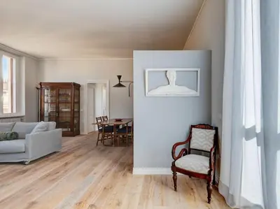 a living room with a couch and a chair at Vatican Luxury Apartment in Rome