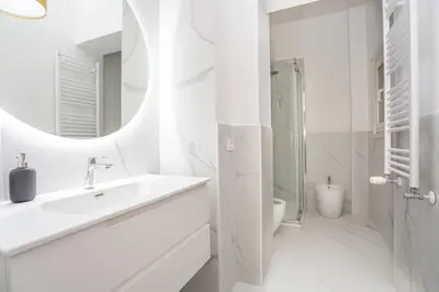 a bedroom with a bed and a couch at Daplace - Allegra Apartment in Rome
