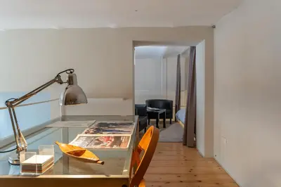 a room with a desk with a lamp and a chair at Esquilino Dream in Rome