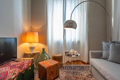 a living room with a couch and a tv at Esquilino Dream in Rome