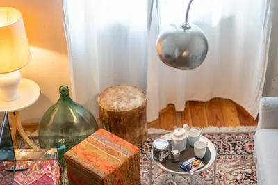 a living room with a table with cups and a vase at Esquilino Dream in Rome