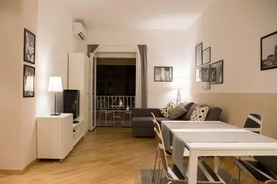 a living room with a couch and a table at Nerhome Vatican Suite in Rome
