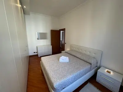 a bedroom with a bed in a white room at Casa Gigi al Vaticano in Rome