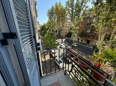 an apartment balcony with a view of a street at Casa Gigi al Vaticano in Rome