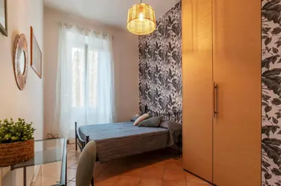 a bedroom with a bed and a window at GuestHost - Lungotevere central and bright apartment in Rome