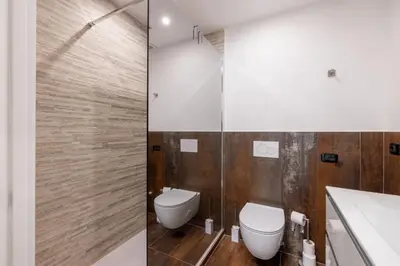 a bathroom with a toilet and a shower at Quattro Fontane 2P - B&D Apartments in Rome