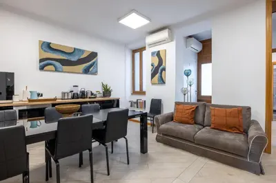 a living room with a couch and a table at Quattro Fontane 2P - B&D Apartments in Rome