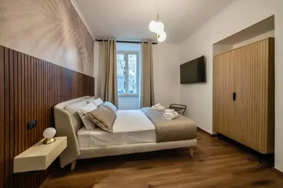 a bedroom with a bed and a window at Vatican Design Suites in Rome