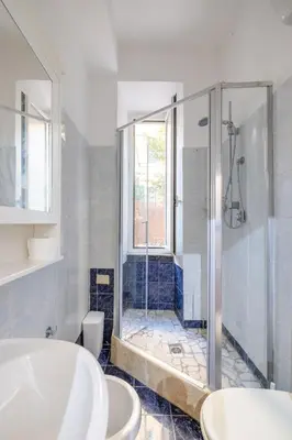a bathroom with two sinks and a shower at CASA GIOVI - Apartment with garden in Rome