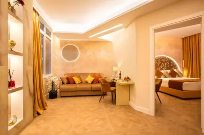 a living room with a couch and a bed at VentiSettembre Private Suites in Rome