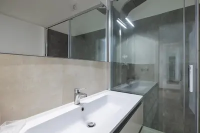 a bathroom with a sink and a mirror at Quattro Fontane 4P - B&D Apts in Rome