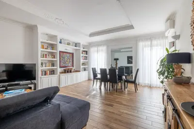 a living room with a couch and a table and chairs at Quattro Fontane 4P - B&D Apts in Rome