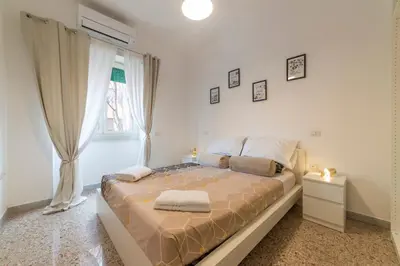 a bedroom with a bed and a window at Trastevere - Monteverde Apartment in Rome