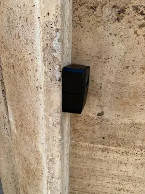 a black box on the side of a wall at Scala Santa Home in Rome