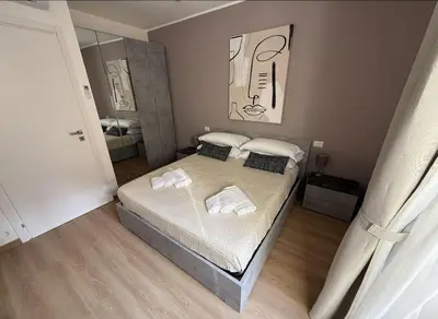 a bedroom with a bed with two towels on it at Colosseo Licia Apartment in Rome