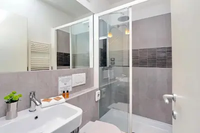 a bathroom with a shower and a sink and a toilet at Campo de fiori charm apartment in Rome