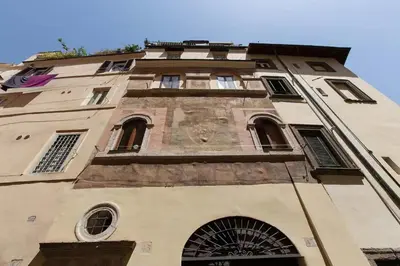 a tall building with a lot of windows on it at Campo de fiori charm apartment in Rome