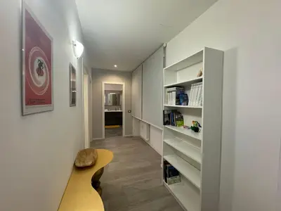 a room with a hallway with a bench and shelves at Urban Oasis Near Appia Antica Park in Rome