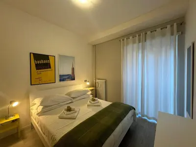 a bedroom with a bed with two trays on it at Urban Oasis Near Appia Antica Park in Rome