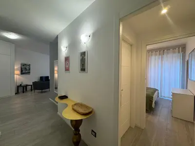 a room with a table and a living room at Urban Oasis Near Appia Antica Park in Rome