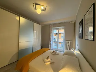 a bedroom with a bed with two candles on it at Urban Oasis Near Appia Antica Park in Rome