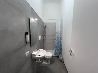 a small bathroom with a sink and a toilet at Green Park San Pancrazio in Rome