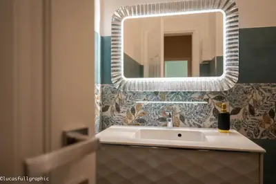 a bathroom with a sink and a mirror at Sophie's choice 3 e Sophie's choice 4 in Rome