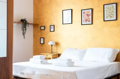 a bedroom with a bed with towels on it at colosseo view apartment in Rome