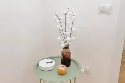 a glass table with a vase on top of it at Nature Flat in Rome