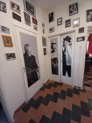 a hallway with pictures on the walls at Camera vista San Pietro in Rome
