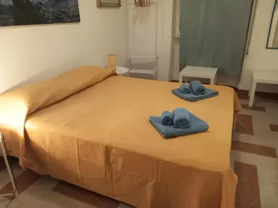 a bedroom with a bed with two towels on it at Camera vista San Pietro in Rome