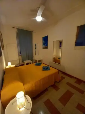 a living room with a bed and a couch at Camera vista San Pietro in Rome