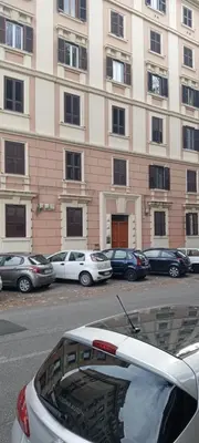 a car parked in front of a large building at Roma ,casa san Paolo in Rome