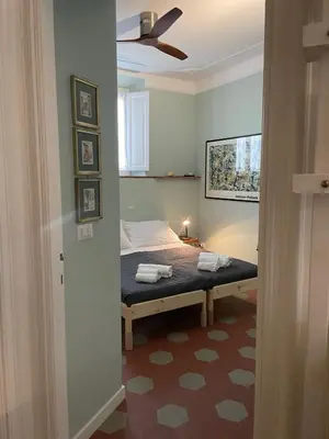 a bedroom with a bed in a room at Iside Apt at Colosseum -2 bedrooms 2 bathrooms in Rome