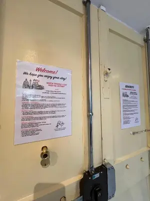 a bathroom door with a sign on it at Maison Trionfale a 2 passi dal Vaticano in Rome