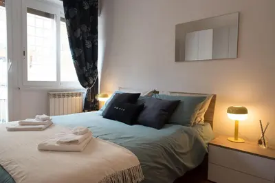 a bedroom with a bed with towels on it at Casa Eva - Roma in Rome