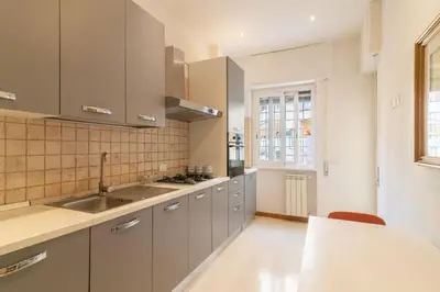 a kitchen with a sink and a counter top at Casa Eva - Roma in Rome