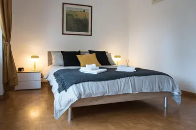 a bedroom with a bed with two towels on it at Casa Eva - Roma in Rome