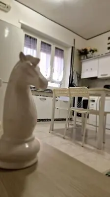 a statue of a horse sitting on a table in a kitchen at Brik's House in Rome