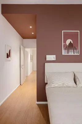 a bedroom with a large bed and a hallway at 4BNB - Suites del Gallo in Rome