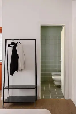 a bathroom with a glass door leading to a toilet at 4BNB - Suites del Gallo in Rome