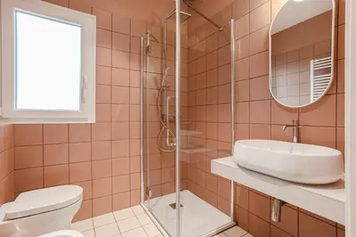 a bathroom with a sink and a toilet and a mirror at 4BNB - Suites del Gallo in Rome