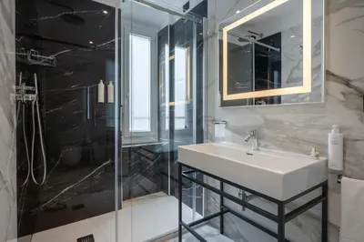 a bathroom with a sink and a shower at BH Hotel in Rome