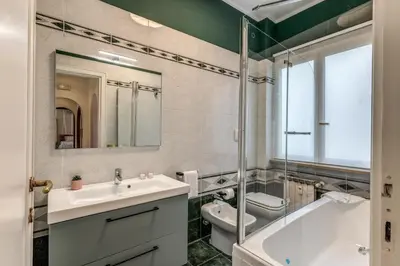a bathroom with a sink and a tub and a toilet at La Casa di Cesare in Rome