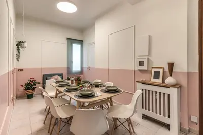 a dining room with a table and chairs at La Casa di Cesare in Rome