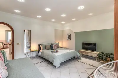 a bedroom with a bed and a fireplace at La Casa di Cesare in Rome