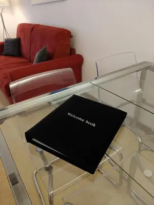 a glass coffee table with a black box on it at Vatican Home Borgo Pio II in Rome